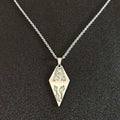 Silver diamond-shaped titanium steel luminous necklace with intricate dragon and flame cutouts for couple jewelry