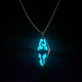 A glowing blue diamond-shaped titanium steel luminous necklace with intricate cut-out designs for couple jewelry