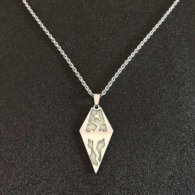 Silver diamond-shaped titanium steel luminous necklace with intricate dragon and flame cutouts for couple jewelry