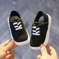 Black canvas toddler shoes korean board with white laces and thick white rubber sole for everyday wear