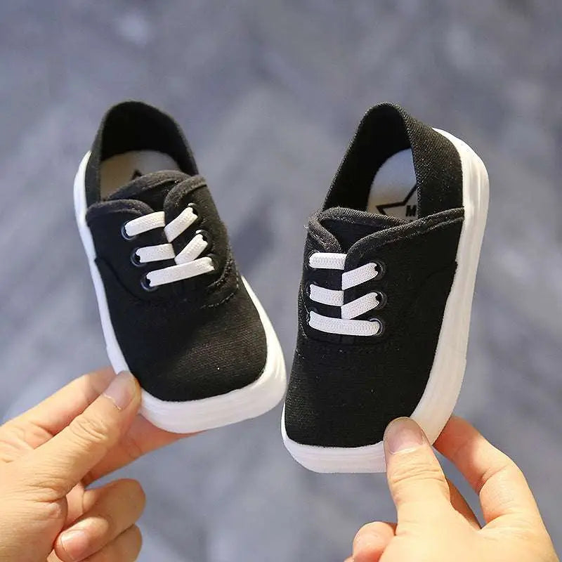Black canvas toddler shoes korean board with white laces and thick white rubber sole for everyday wear