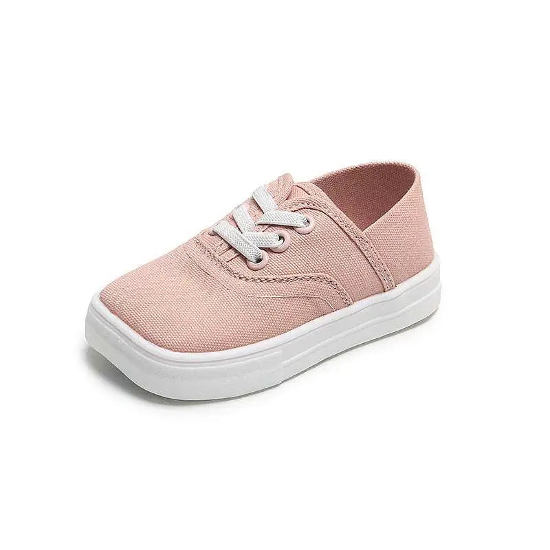 Three toddler canvas shoes korean board shoes in pastel pink, white, and mustard with white rubber soles and mg baby logo