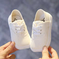 Toddler canvas shoes korean board style in white rubber with matching laces and a classic design