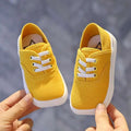 Toddler canvas shoes Korean board style in bright yellow with white laces and thick white rubber sole