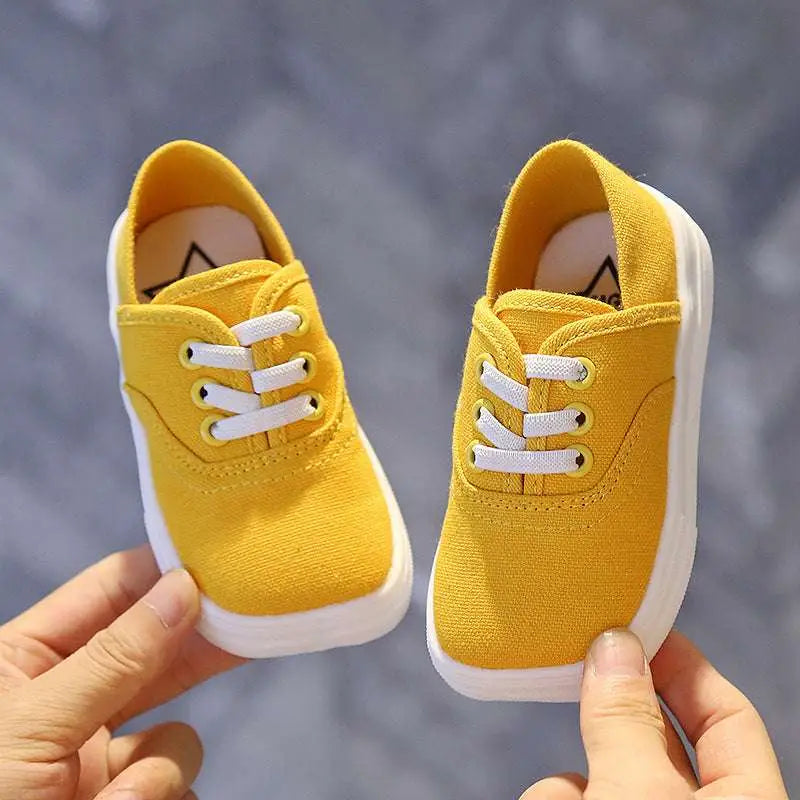 Toddler canvas shoes Korean board style in bright yellow with white laces and thick white rubber sole