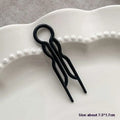 Black metal lazy updo gadget hair clip with sleek twisted design and circular top loop for bun lazy styling