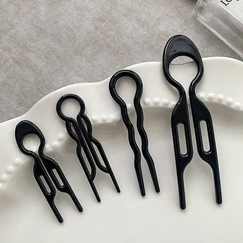 Set of five sleek black plastic tortoiseshell bun lazy updo gadget hair clips with wavy and oval designs for bun lazy styling