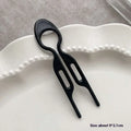 Black plastic phone card slotting tool with two elongated slots for tortoiseshell bun lazy updo gadget styling