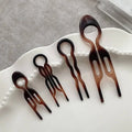 Set of five tortoiseshell acrylic hair clips with wavy looped tops for elegant bun lazy styling and lazy updo gadget use