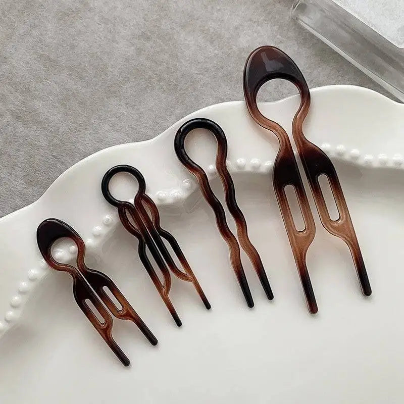Set of five glossy tortoiseshell plastic hair clips designed as lazy updo gadget for tortoiseshell bun lazy styling
