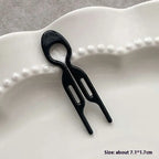 Black plastic lazy updo gadget hair clip with sleek modern design two prongs and oval handle for bun lazy styling