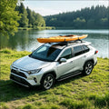 White toyota rav4 suv with bright orange kayak secured on roof rack featuring tower feet cross bars length x width design