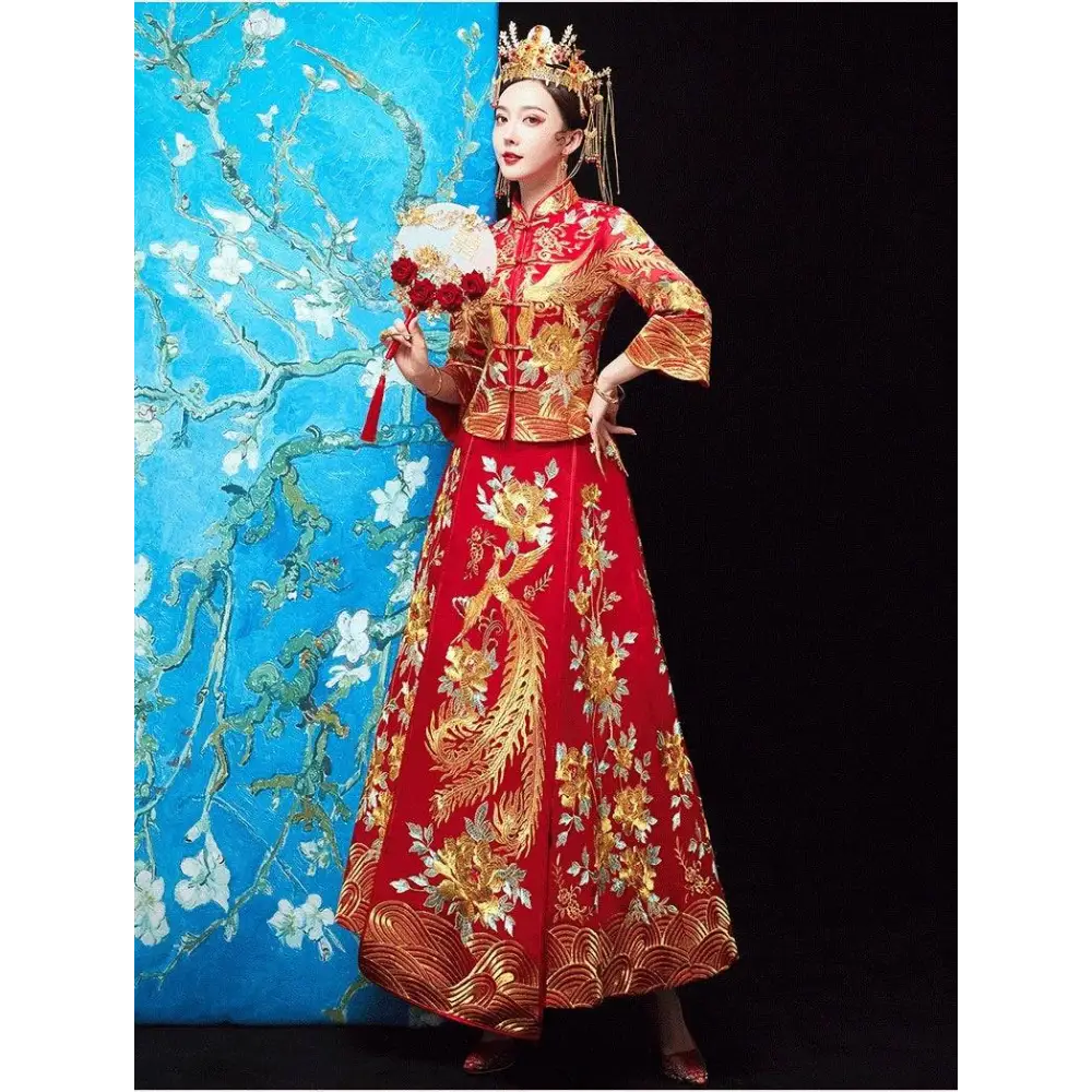 A vibrant red traditional chinese robes xiuhe wedding gown with gold embroidered phoenix and floral patterns
