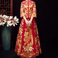 A vibrant red traditional Chinese robes xiuhe wedding dress with gold and silver phoenix embroidery and long sleeves