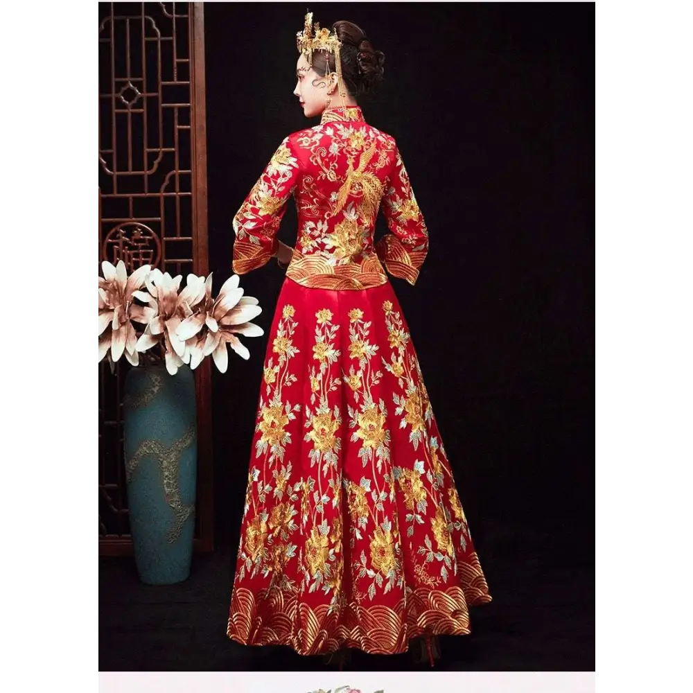 A vibrant red traditional robes xiuhe dress with intricate gold chinese dragon and floral embroidery and a high collar