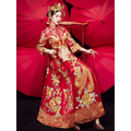 A woman wears a vibrant red robes xiuhe traditional chinese dragon wedding gown with gold and silver embroidery