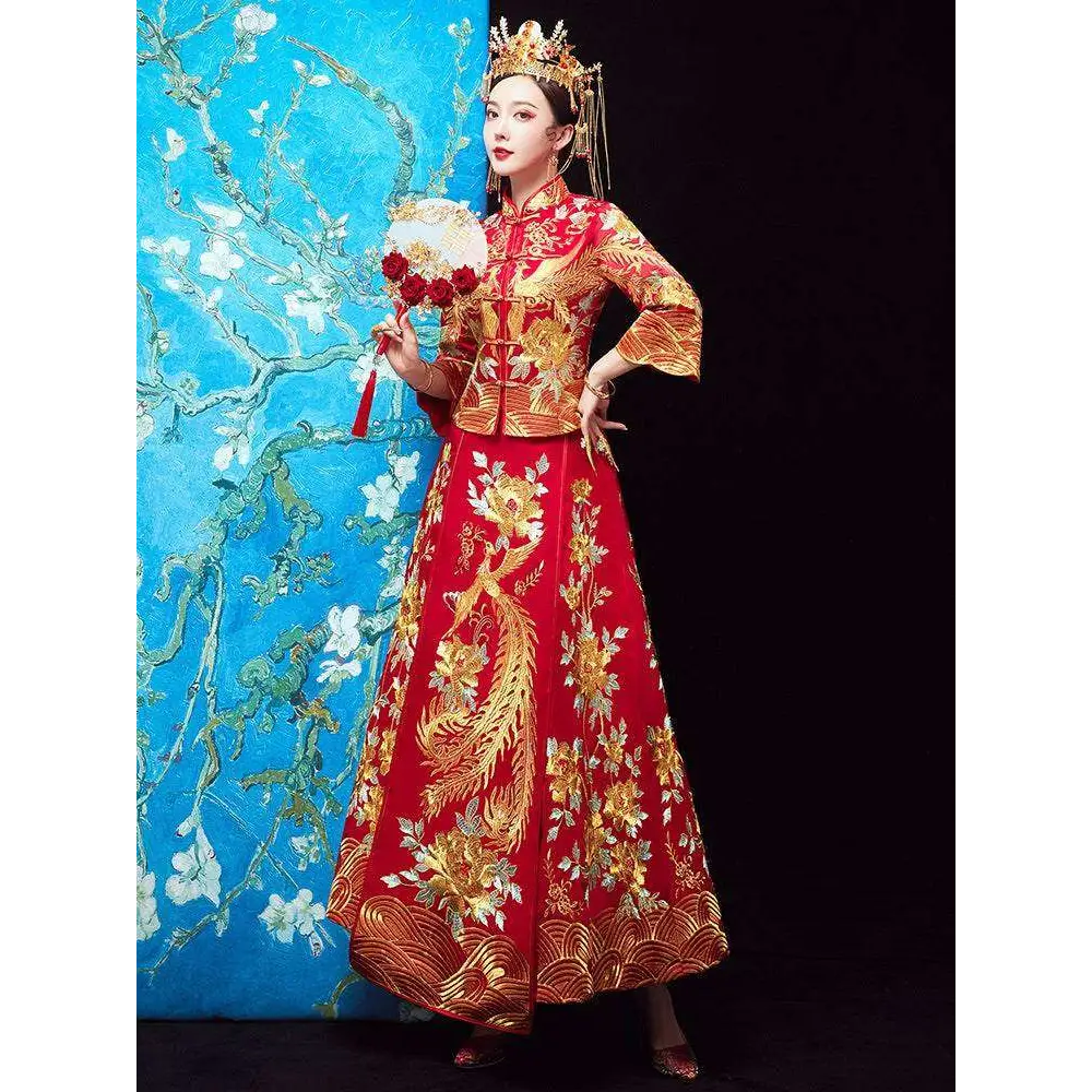 A vibrant red traditional chinese robes xiuhe dress with golden phoenix embroidery and high collar long sleeves