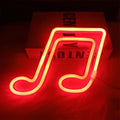 A glowing red neon music note sign with warm yellow inner glow in treble clef blue neon bar lights design