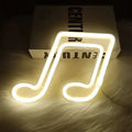 A glowing white neon bar lights shaped like a treble clef blue musical note for decorative use