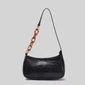 Trendy small crocodile black handbag with acrylic chain strap in tortoiseshell for stylish everyday use