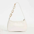 A sleek white leather shoulder trendy small crocodile bag with a distinctive acrylic chain strap featuring bone links