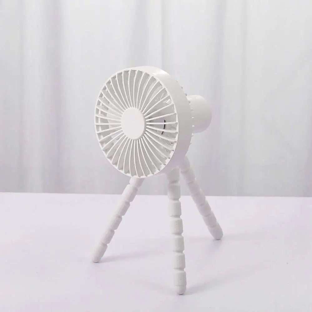 White tripod small fan with adjustable multifunctional desktop stand for cooling in various settings