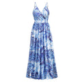 A flowing blue and white tropical leaf print summer swing dress with thin spaghetti straps ideal for warm weather