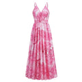 A flowing pink and white tropical leaf print summer swing dress with thin spaghetti straps perfect for summer wear