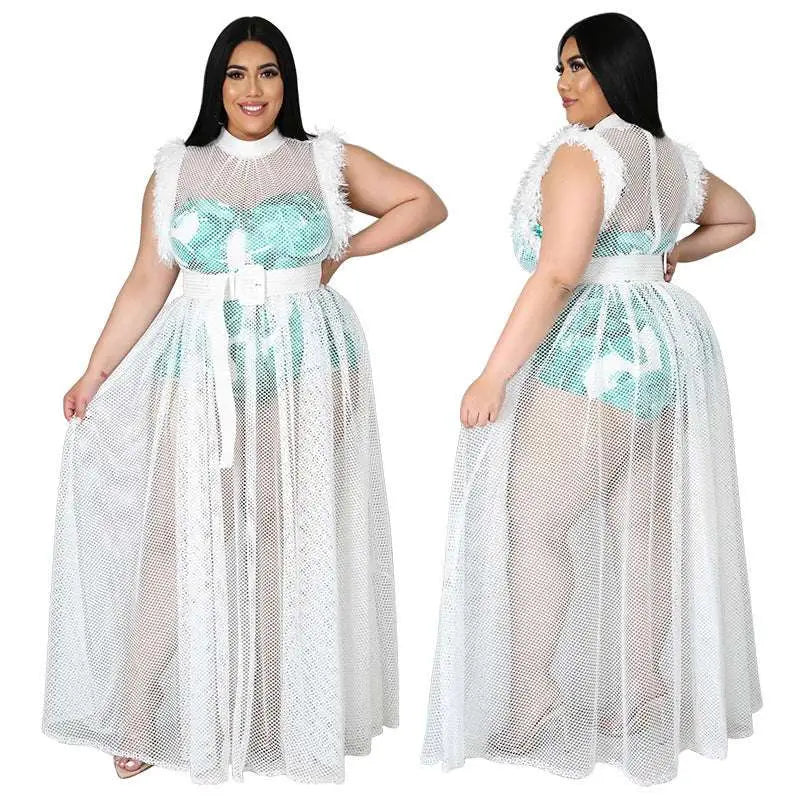 A plus-size woman wears a fashionable temperament mesh plus size tropical leaf mesh sheer white maxi dress with turquoise sequins