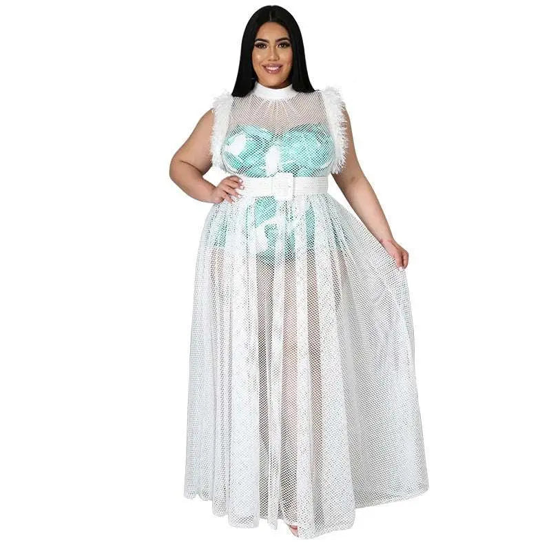 A plus size woman wears a fashionable temperament mesh white maxi dress with feathered shoulders and turquoise sequined bodice