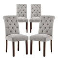 Set of four gray tufted fabric dining chairs with durable solid wood legs and linen-look fabric stretched upholstery