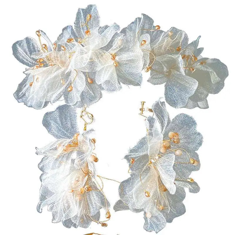 Delicate silver and white tulle flower headband earring set adorned with gold-toned beads and organza tulle flowers