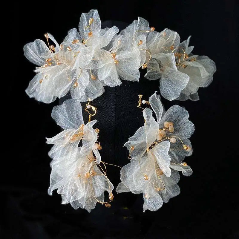 Delicate white organza tulle flower headband earring set adorned with gold-toned beads and wire detailing