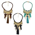 Three bohemian-style turquoise gold feather leaf tassel necklaces with gold-toned hammered metal and feathers in brown teal and black
