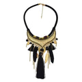 Turquoise gold feather leaf tassel necklace with black and gold bohemian design featuring feather accents and metallic coins