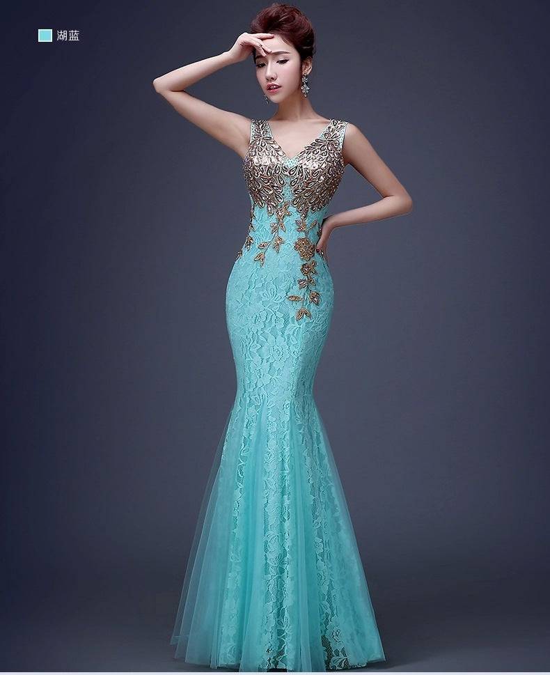 A turquoise mermaid-style gown with intricate gold lace and beading detailing embodies affordable luxury beauty in elegant fashion.