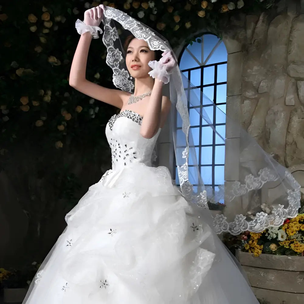 White lace bridal veil with delicate floral embroidery and scalloped edges from veil lace headdresses collection