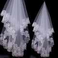 Two elegant white bridal veil lace headdresses featuring intricate floral embroidery on layered edges