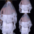 White two layer bridal sequined polyester veil with delicate lace and beaded embellishments in a tiered flowing design