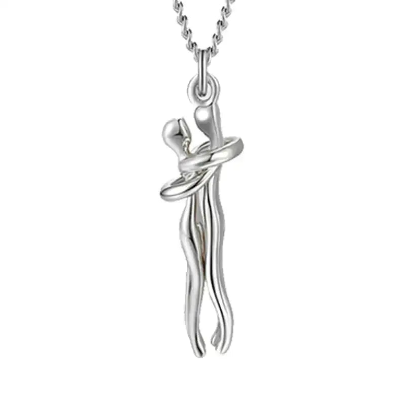 Gold and silver two tone abstract hug necklace unisex featuring a couple pendant on a gold chain for men and women