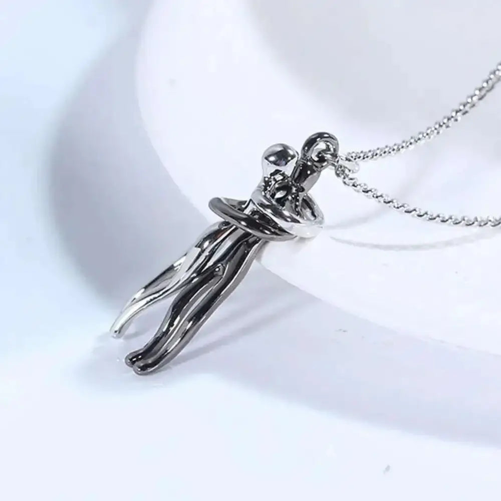 Silver-toned two tone abstract hug necklace unisex men featuring sleek minimalist intertwined figures design