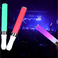 Two white led glow stick lights with wrist straps featuring green red and purple stick fluorescent tubes with silver ends