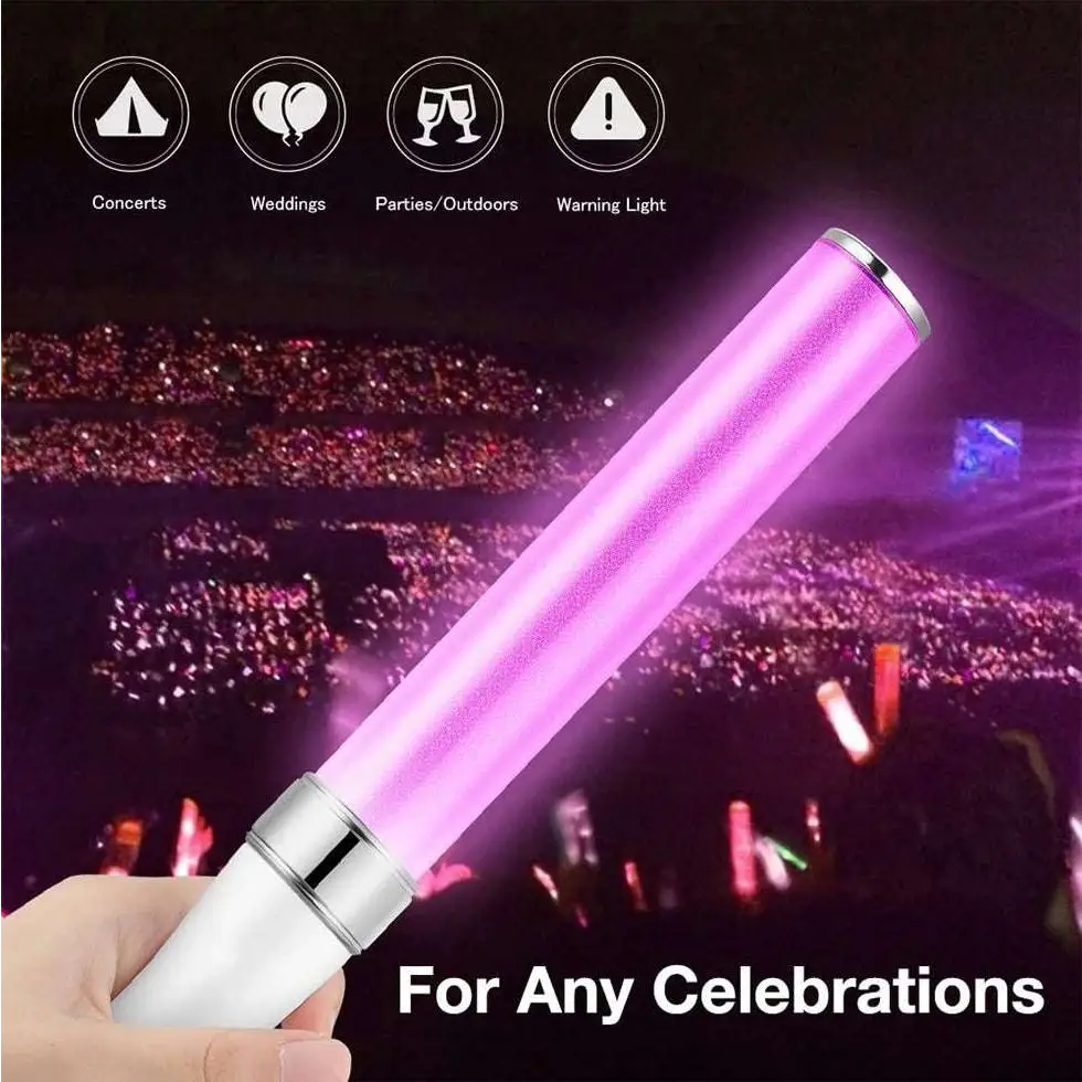 A pink glowing led light stick with white handle and silver metallic accents featuring wrist straps for concerts and parties