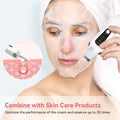 White handheld ultrasonic facial skin scrubber with black control panel and usb rechargeable anti-acne function metallic tip