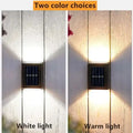 Solar powered garden up and down wall sconce with square dark metal frame using solar power technology emitting white or warm light
