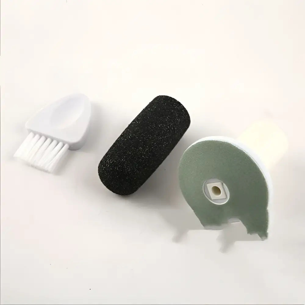 Black textured usb rechargeable electric callus remover with foam nail file, sponge pad, and brush for foot care