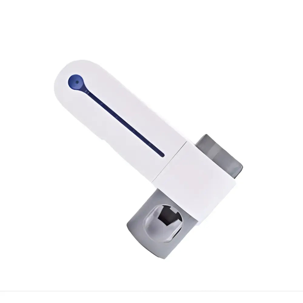 White plastic child safety lock with blue button and gray metallic parts on the back of a sterilizing toothbrush holder and toothpaste dispenser