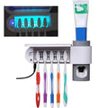 White and gray wall-mounted sterilizing toothbrush holder with uv sterilizer and automatic toothpaste dispenser holding five brushes