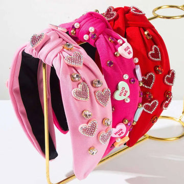 Valentines day headband with pink and red velvet knotted love accessories featuring sparkling heart-shaped rhinestones pearls and candy heart charms