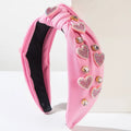 Pink valentines day headband knotted love accessories with sparkling heart-shaped rhinestones and gold-toned embellishments
